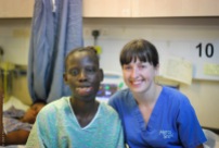 Nurse, Lynette Givan, with a patient on the wards.
